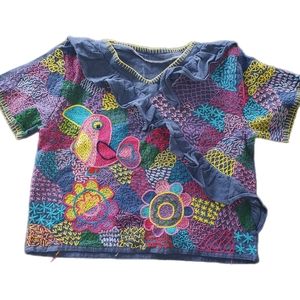 Embroidered ruffle top